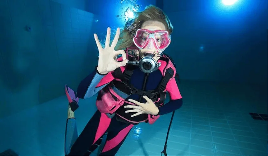 Happy diver giving the OK sign after successfully clearing their mask with Scorpion Dive in Sharm El Sheikh.